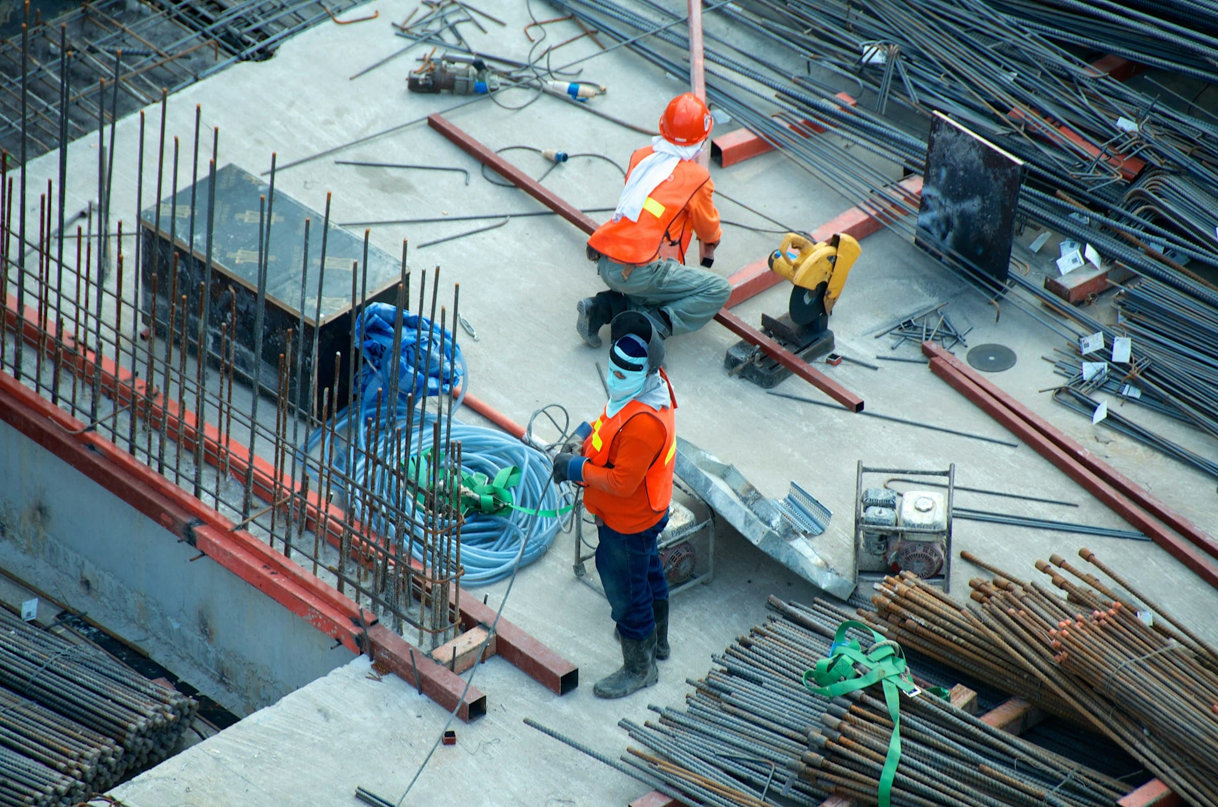 Overhead view of an active jobsite with rebar and crew